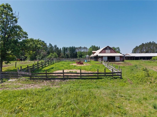 4271 220th St, Cadott, WI 54727 - view of yard featuring an outdoor structure, a barn, an exterior structure, and a rural view