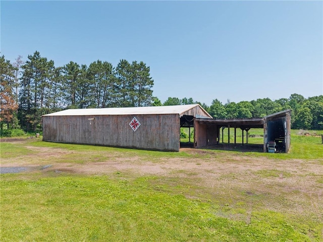4271 220th St, Cadott, WI 54727 - view of pole building with a yard and a detached carport