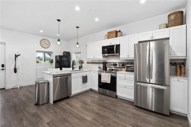4271 220th St, Cadott, WI 54727 - kitchen with appliances with stainless steel finishes, white cabinets, decorative backsplash, light countertops, and recessed lighting