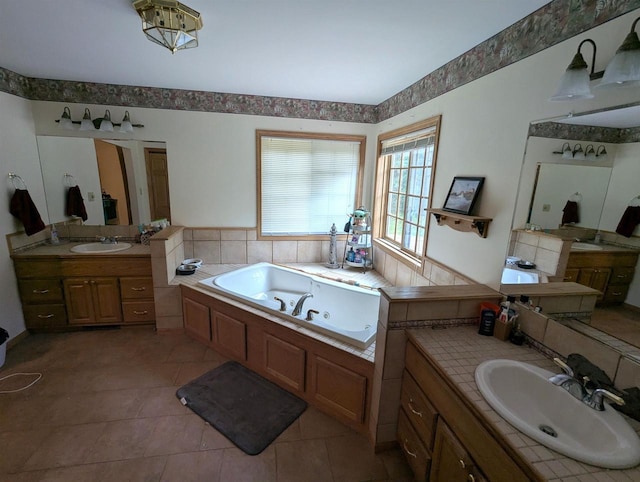 1817 S Duck Creek Dr, Friendship, WI 53934 - bathroom featuring a whirlpool tub, two vanities, and tile patterned flooring