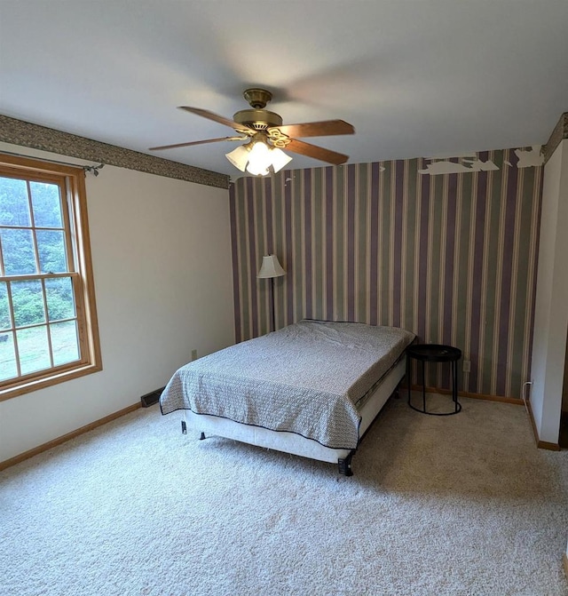 1817 S Duck Creek Dr, Friendship, WI 53934 - bedroom with carpet floors, a ceiling fan, and wallpapered walls
