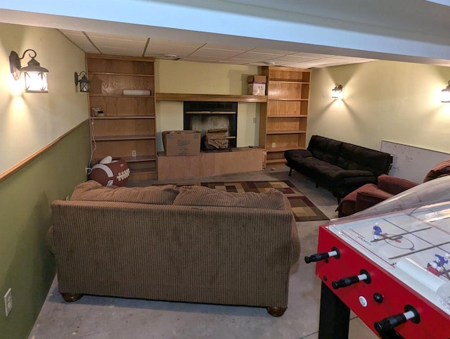1817 S Duck Creek Dr, Friendship, WI 53934 - living area featuring a paneled ceiling and concrete floors