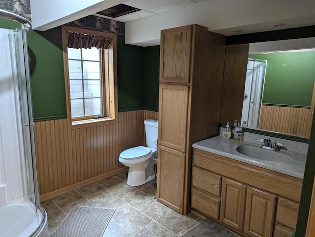 1817 S Duck Creek Dr, Friendship, WI 53934 - bathroom featuring wainscoting, a shower stall, vanity, and wooden walls