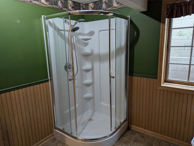 1817 S Duck Creek Dr, Friendship, WI 53934 - bathroom with a wainscoted wall, a shower stall, healthy amount of natural light, and wooden walls