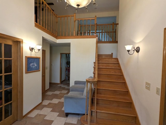 1817 S Duck Creek Dr, Friendship, WI 53934 - staircase featuring baseboards and a towering ceiling
