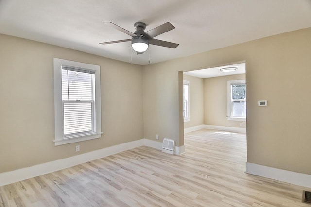1541 Porter Ave, Beloit, WI 53511 - spare room featuring ceiling fan, light wood finished floors, and plenty of natural light