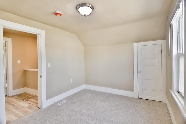 1541 Porter Ave, Beloit, WI 53511 - bonus room with vaulted ceiling, light colored carpet, and plenty of natural light