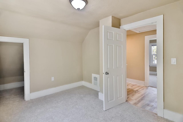 1541 Porter Ave, Beloit, WI 53511 - additional living space featuring carpet flooring, lofted ceiling, and attic access