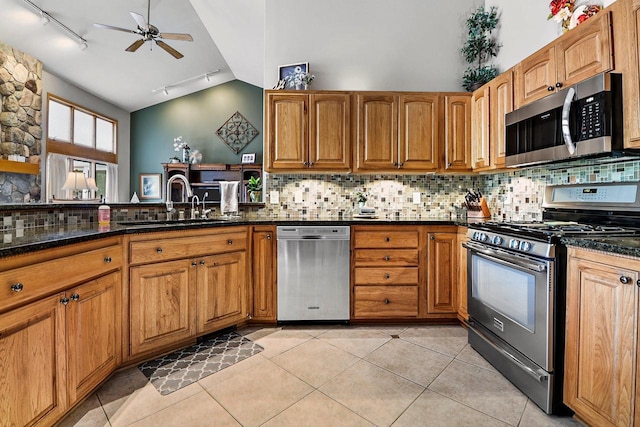 6320 10th Pl, Kenosha, WI 53144 - kitchen featuring stainless steel appliances, rail lighting, backsplash, a ceiling fan, and light tile patterned flooring