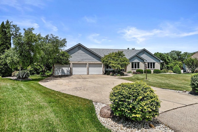 6320 10th Pl, Kenosha, WI 53144 - single story home with driveway, an attached garage, a front yard, and brick siding