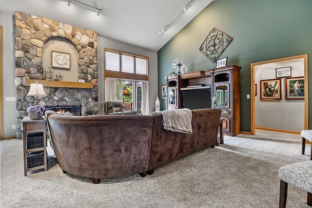 6320 10th Pl, Kenosha, WI 53144 - living area with rail lighting, carpet floors, a fireplace, and high vaulted ceiling