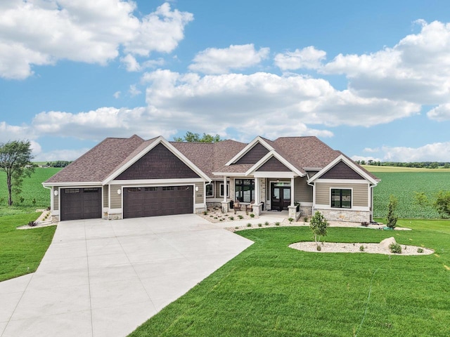 3330 Colton Way, Sun Prairie, WI 53590 - craftsman house featuring stone siding, a garage, a front lawn, concrete driveway, and a porch