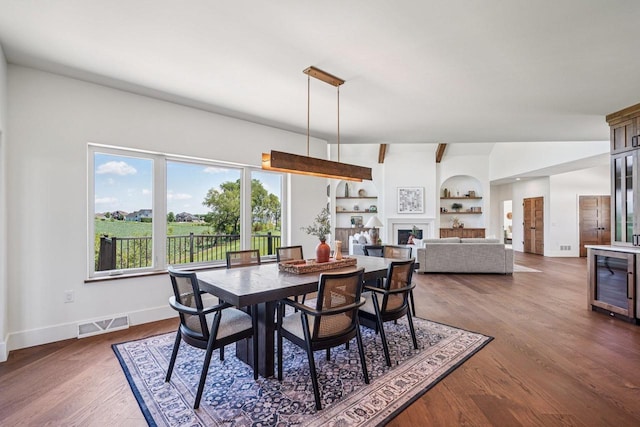 3330 Colton Way, Sun Prairie, WI 53590 - dining area with dark wood-style floors, wine cooler, and built in shelves