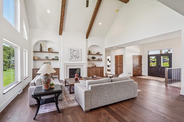 3330 Colton Way, Sun Prairie, WI 53590 - living room featuring high vaulted ceiling, built in features, beamed ceiling, a fireplace, and dark wood finished floors