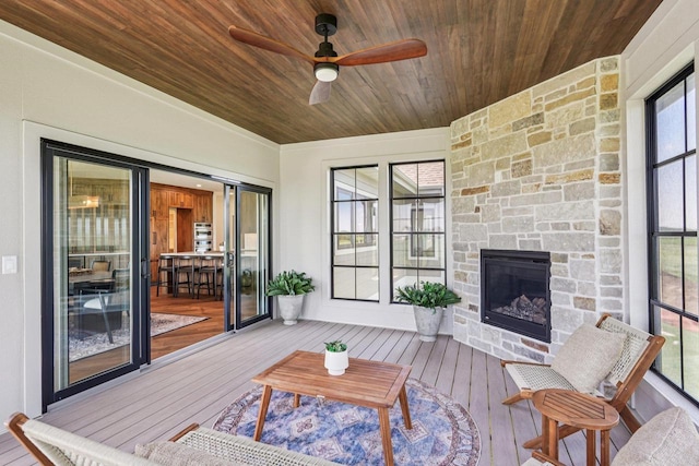 3330 Colton Way, Sun Prairie, WI 53590 - sunroom featuring an outdoor stone fireplace, ceiling fan, and plenty of natural light