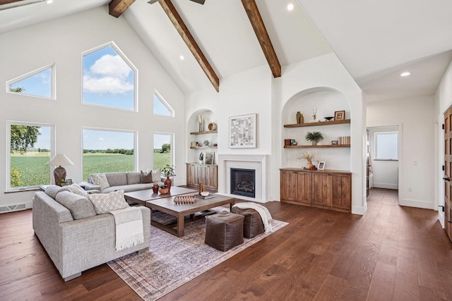 3330 Colton Way, Sun Prairie, WI 53590 - living room with dark wood-style flooring, high vaulted ceiling, beam ceiling, built in features, and a fireplace with flush hearth