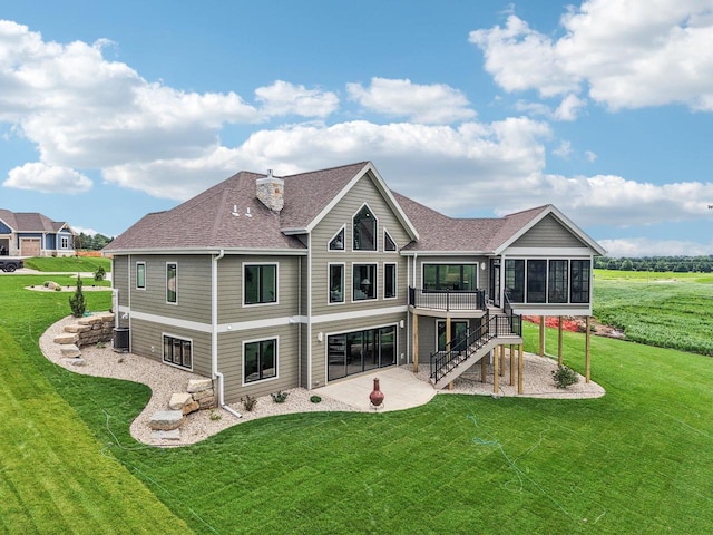3330 Colton Way, Sun Prairie, WI 53590 - back of property with a patio, stairs, roof with shingles, a sunroom, and a yard
