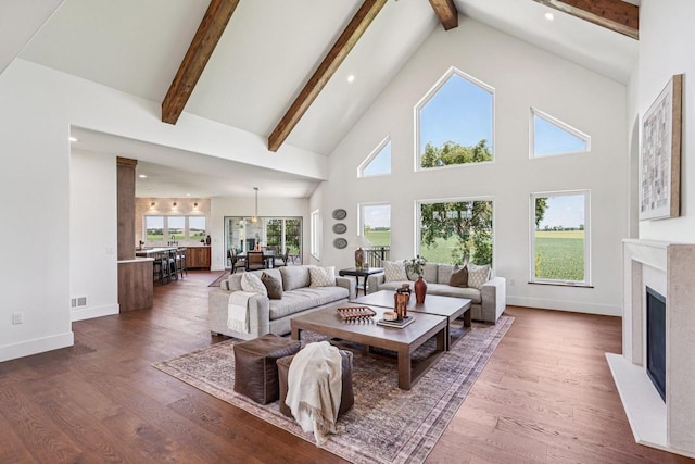 3330 Colton Way, Sun Prairie, WI 53590 - living room featuring high vaulted ceiling, beam ceiling, recessed lighting, a fireplace, and dark wood finished floors