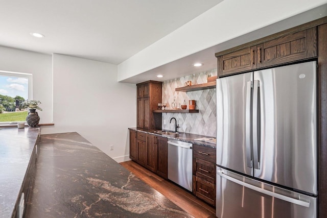 3330 Colton Way, Sun Prairie, WI 53590 - kitchen with appliances with stainless steel finishes, open shelves, tasteful backsplash, dark stone counters, and recessed lighting