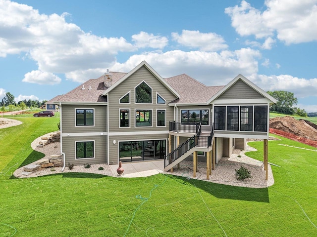 3330 Colton Way, Sun Prairie, WI 53590 - rear view of house featuring a patio area, a sunroom, a shingled roof, and a yard