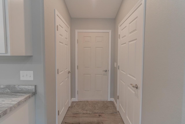 219 Joe St, Stevens Point, WI 54481 - doorway to outside featuring wood finished floors and baseboards