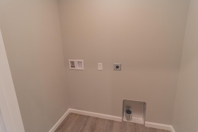 219 Joe St, Stevens Point, WI 54481 - washroom featuring electric dryer hookup, hookup for a washing machine, and light wood-style floors