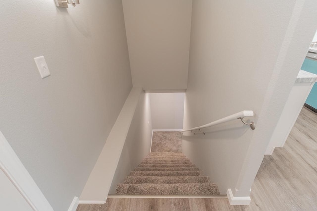 219 Joe St, Stevens Point, WI 54481 - stairs featuring baseboards and wood finished floors