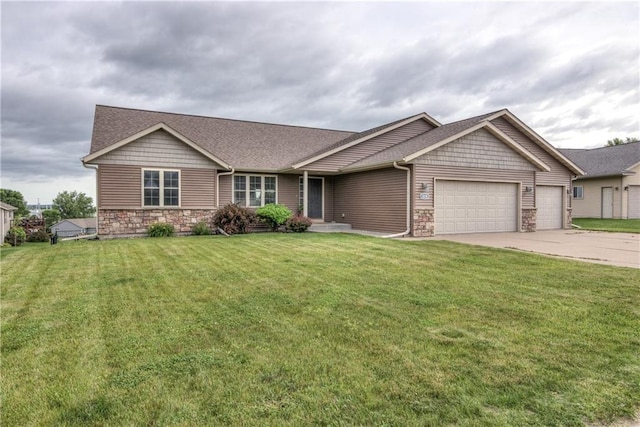 1814 Lynnette Ct, Eau Claire, WI 54703 - view of front of house featuring stone siding, a garage, driveway, and a front yard