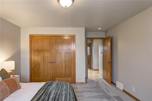 1814 Lynnette Ct, Eau Claire, WI 54703 - carpeted bedroom with baseboards and a closet
