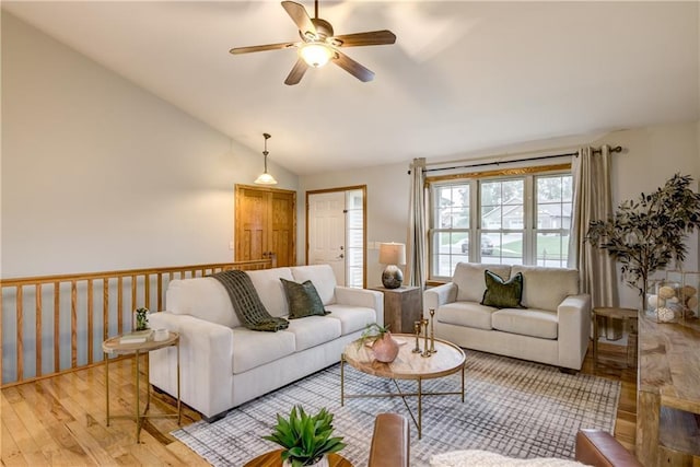 1814 Lynnette Ct, Eau Claire, WI 54703 - living area featuring wood finished floors, vaulted ceiling, and a ceiling fan