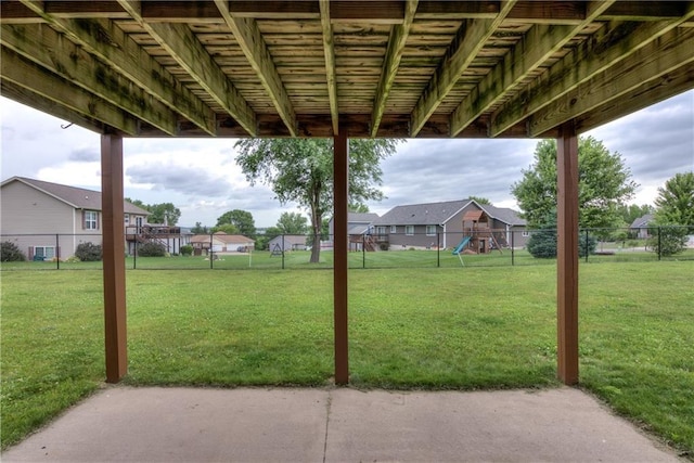 1814 Lynnette Ct, Eau Claire, WI 54703 - fenced backyard featuring a playground, a residential view, and a patio area