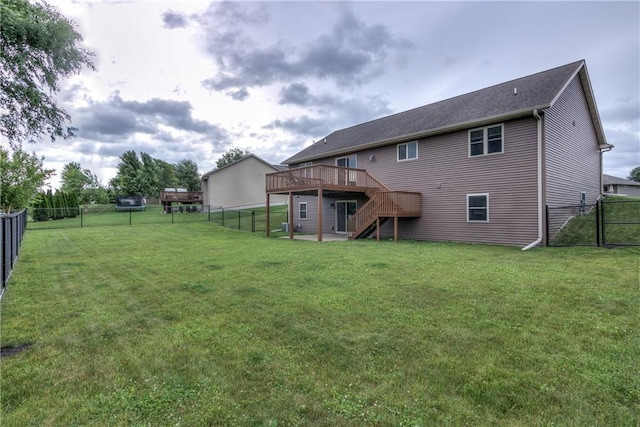 1814 Lynnette Ct, Eau Claire, WI 54703 - back of property with a fenced backyard, a deck, stairway, and a gate