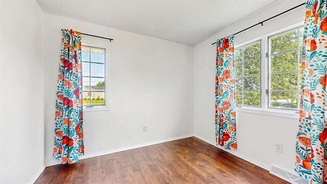 701 Devils Ln, Walworth, WI 53184 - spare room featuring wood finished floors and baseboards