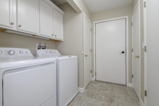 18520 Emerald Cir Unit D, Brookfield, WI 53045 - laundry room featuring separate washer and dryer, stone finish floors, and cabinet space