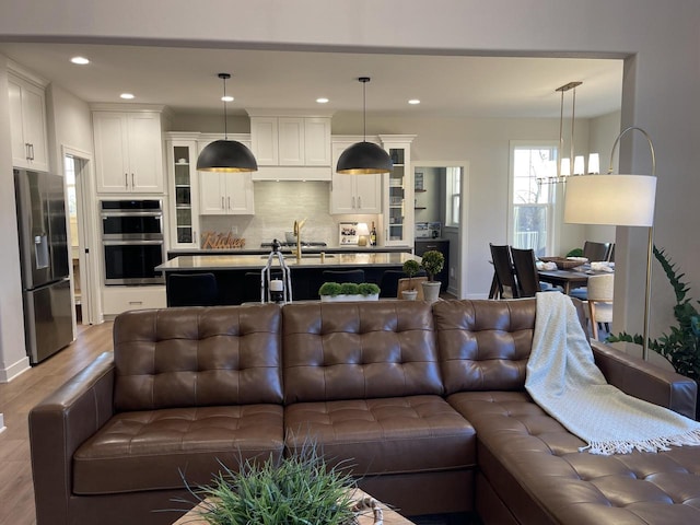 W214N6683 Fairview Dr, Menomonee Falls, WI 53051 - living area featuring wood finished floors and recessed lighting