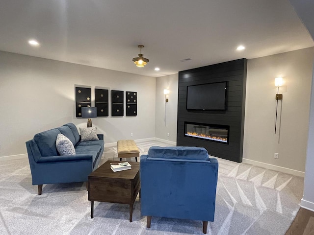 W214N6683 Fairview Dr, Menomonee Falls, WI 53051 - living area with recessed lighting, light colored carpet, and a large fireplace