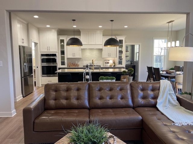W214N6683 Fairview Dr, Menomonee Falls, WI 53051 - living room featuring light wood-style flooring and recessed lighting