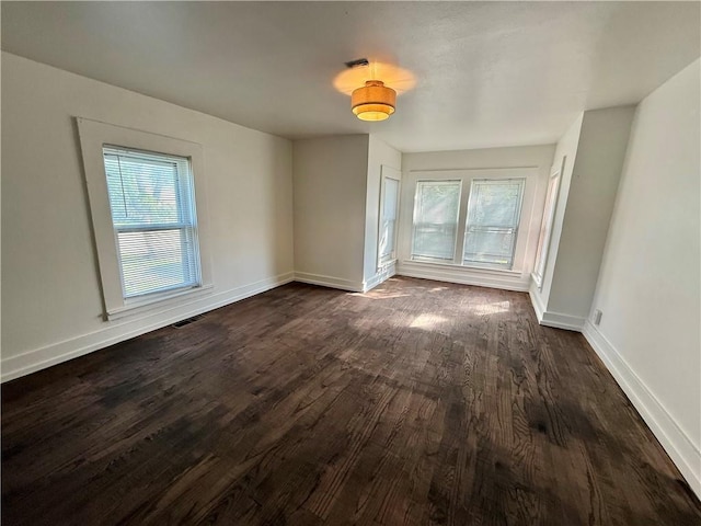 15 S Culver St, Chippewa Falls, WI 54729 - spare room featuring dark wood finished floors and baseboards