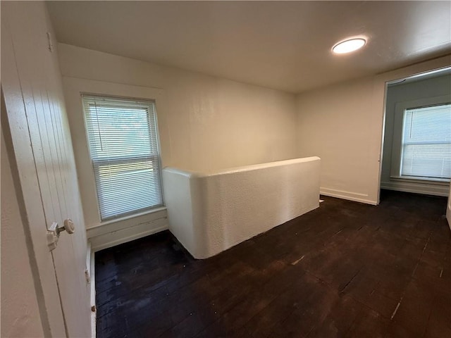 15 S Culver St, Chippewa Falls, WI 54729 - corridor featuring dark wood finished floors, plenty of natural light, and an upstairs landing