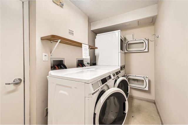 26 10th St Unit 1104, Saint Paul, MN 55102 - shared laundry featuring stacked washer and clothes dryer and washing machine and dryer