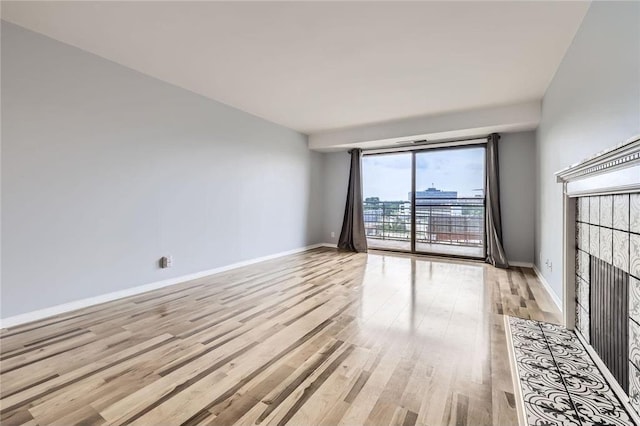 26 10th St Unit 1104, Saint Paul, MN 55102 - spare room featuring light wood-style flooring and baseboards