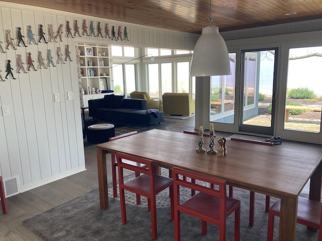 N155 Surfside Dr, Cedar Grove, WI 53013 - dining area featuring wood finished floors, wood ceiling, and wooden walls