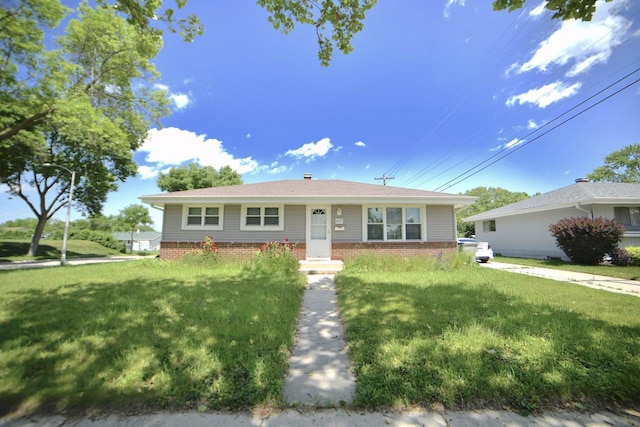 8750 W Hustis St, Milwaukee, WI 53224 - view of front of property featuring a front lawn and brick siding