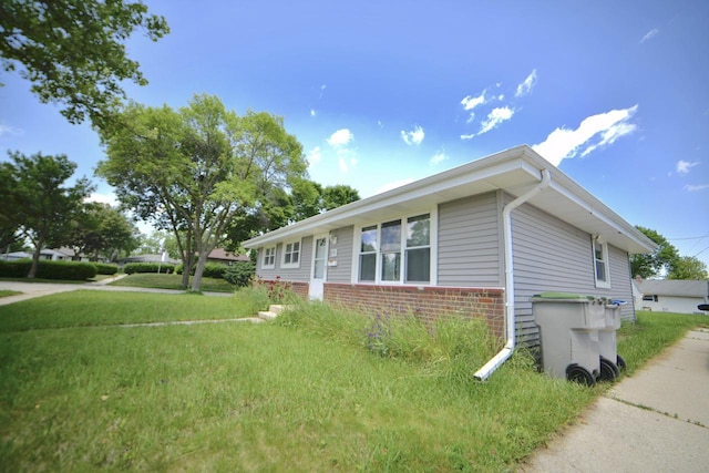 8750 W Hustis St, Milwaukee, WI 53224 - view of home's exterior with brick siding