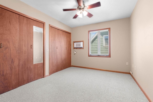 114 S Adam St, South Beloit, IL 61080 - unfurnished bedroom with a wall mounted AC, carpet floors, and a ceiling fan
