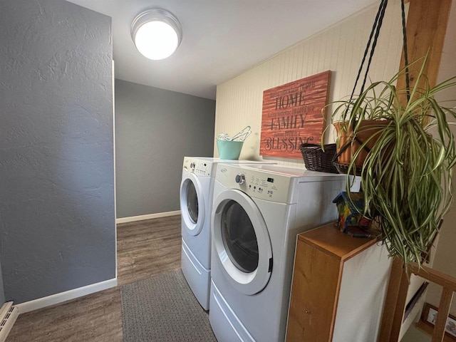 710 Jefferson St, Merrill, WI 54452 - laundry area with washing machine and clothes dryer, wood finished floors, a textured wall, and baseboard heating