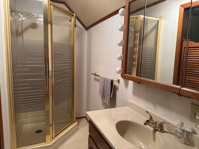 710 Jefferson St, Merrill, WI 54452 - bathroom featuring vaulted ceiling, vanity, ornamental molding, and a shower stall