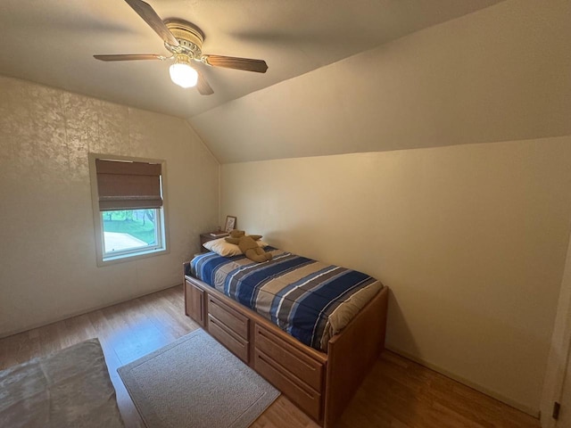 710 Jefferson St, Merrill, WI 54452 - bedroom with wood finished floors, vaulted ceiling, and ceiling fan