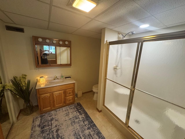 710 Jefferson St, Merrill, WI 54452 - bathroom featuring a drop ceiling, a stall shower, vanity, and tile patterned floors