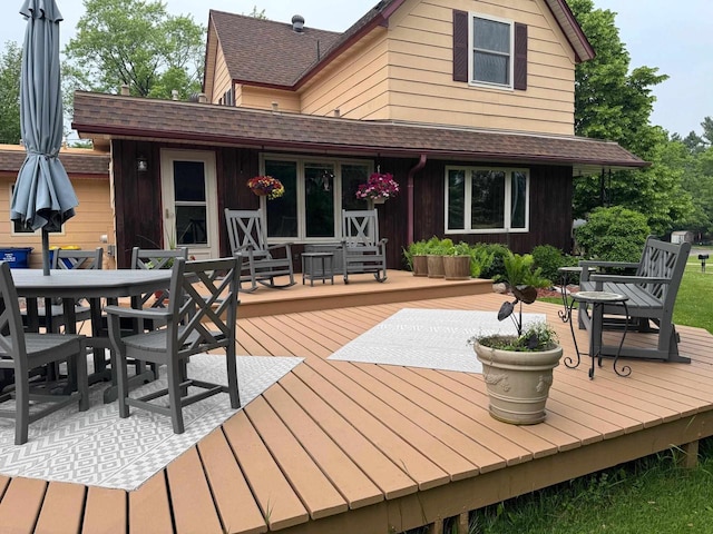 710 Jefferson St, Merrill, WI 54452 - wooden terrace with outdoor dining area
